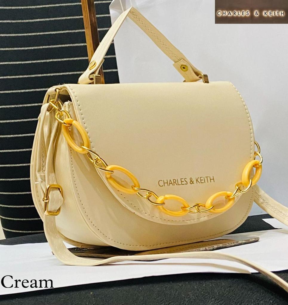 Circular Elegance: Round Shape Sling Bag with Plastic Design Chain